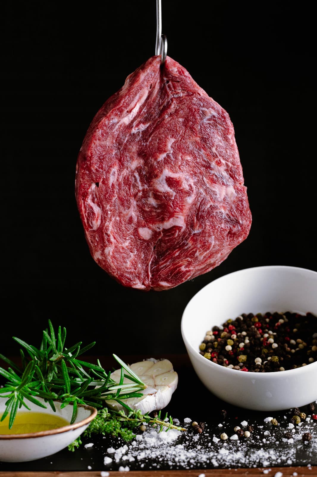Marbled dry-aged beef with rosemary, garlic and peppercorns
