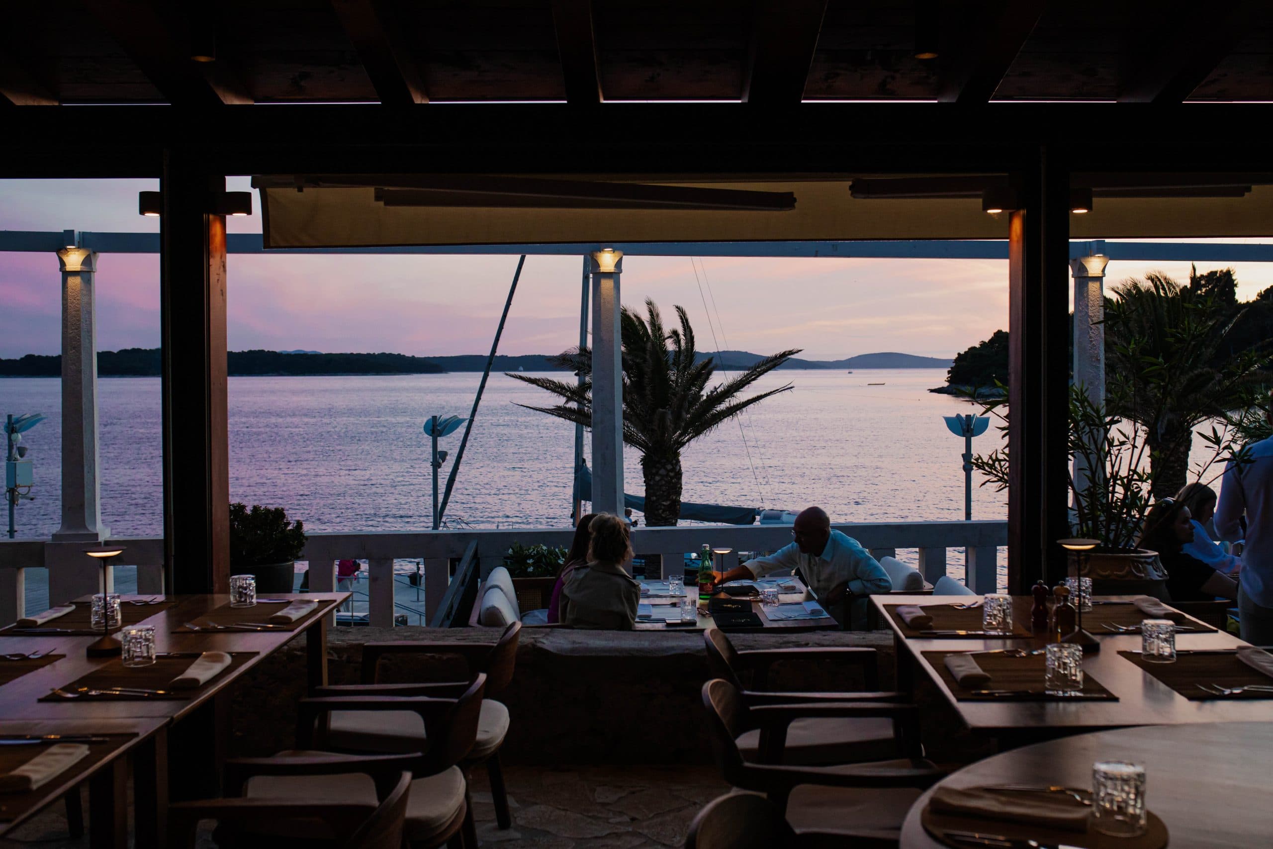 Dusk over the Adriatic seen through the terrace pergola