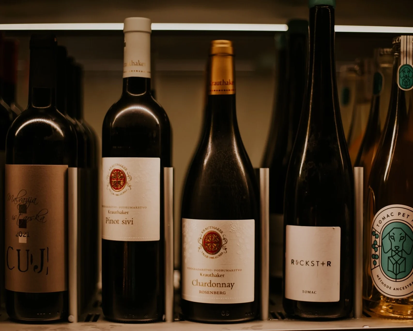 Croatian wines on the cellar shelf, Krauthaker and Tomac in front